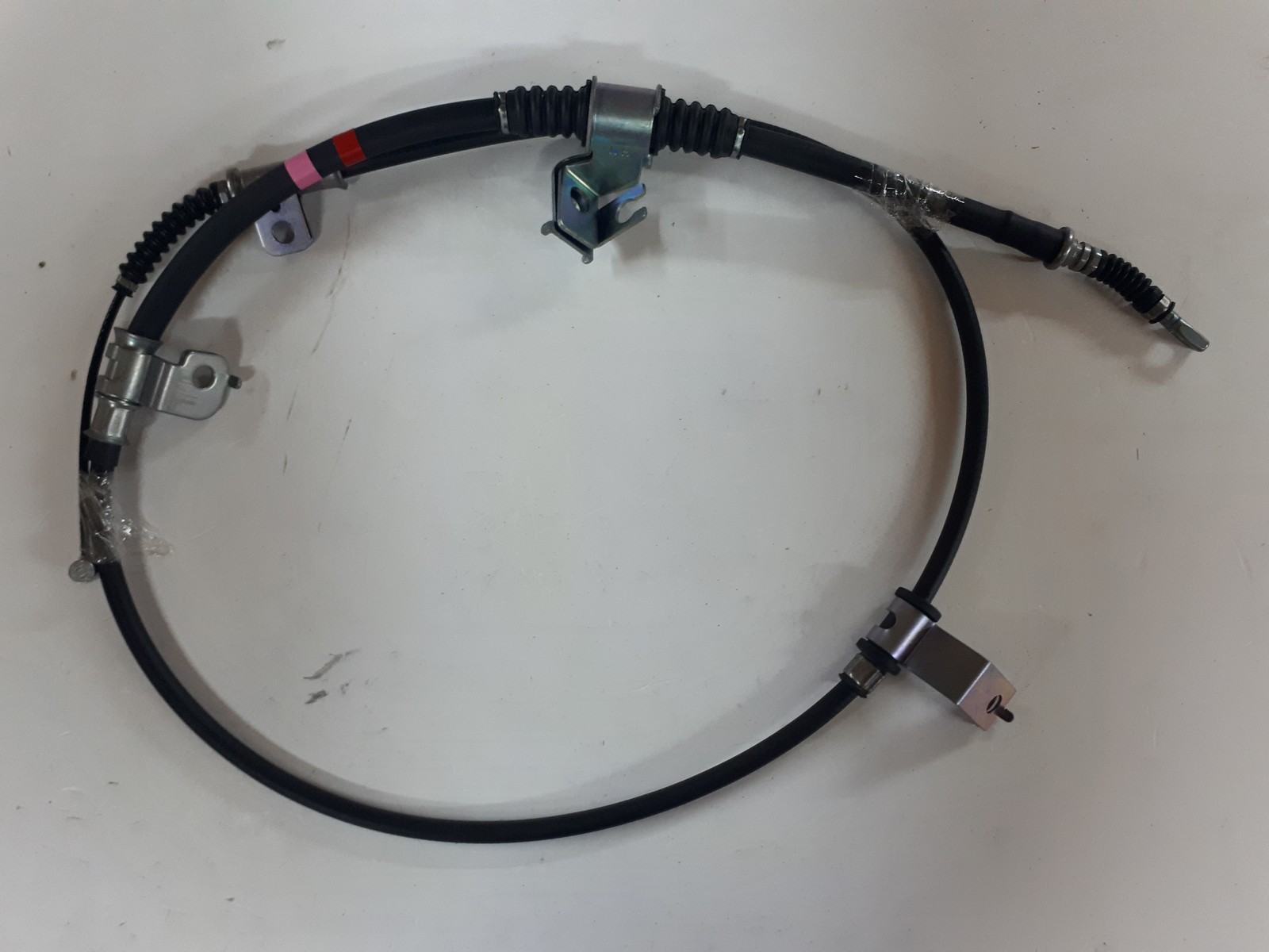 Hyundai/Kia 597604H730 Трос стояночного гальма Hyundai/Kia 597604H730 Трос стояночного гальма